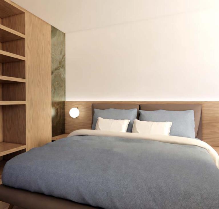 Modern, cozy bedroom with a soft bed and warm lighting.